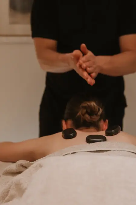 Massage with hot stones